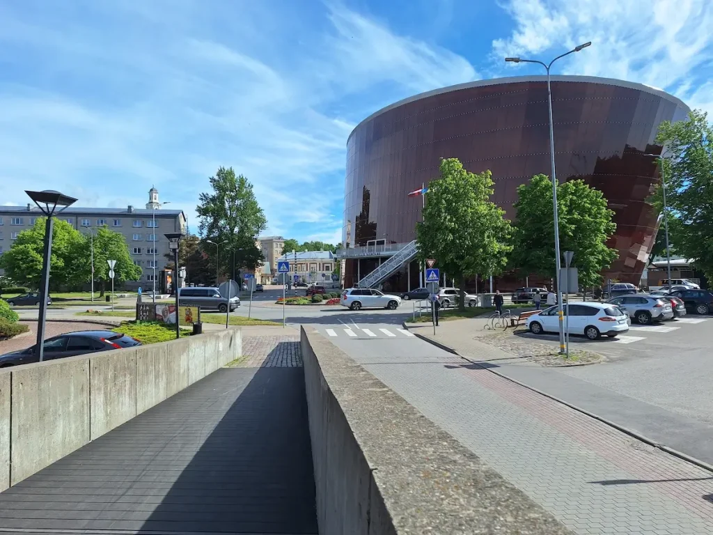reat Amber Concert Hall in Liepāja with its curved amber facade beside the street