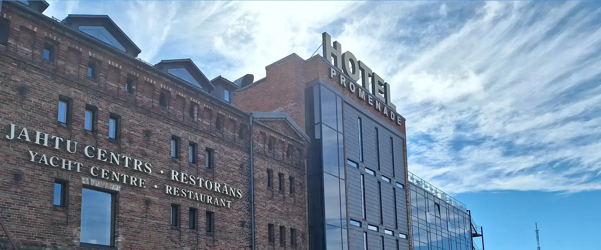 Promenade Hotel and marina buildings in Liepāja city centre near the Trade Canal.