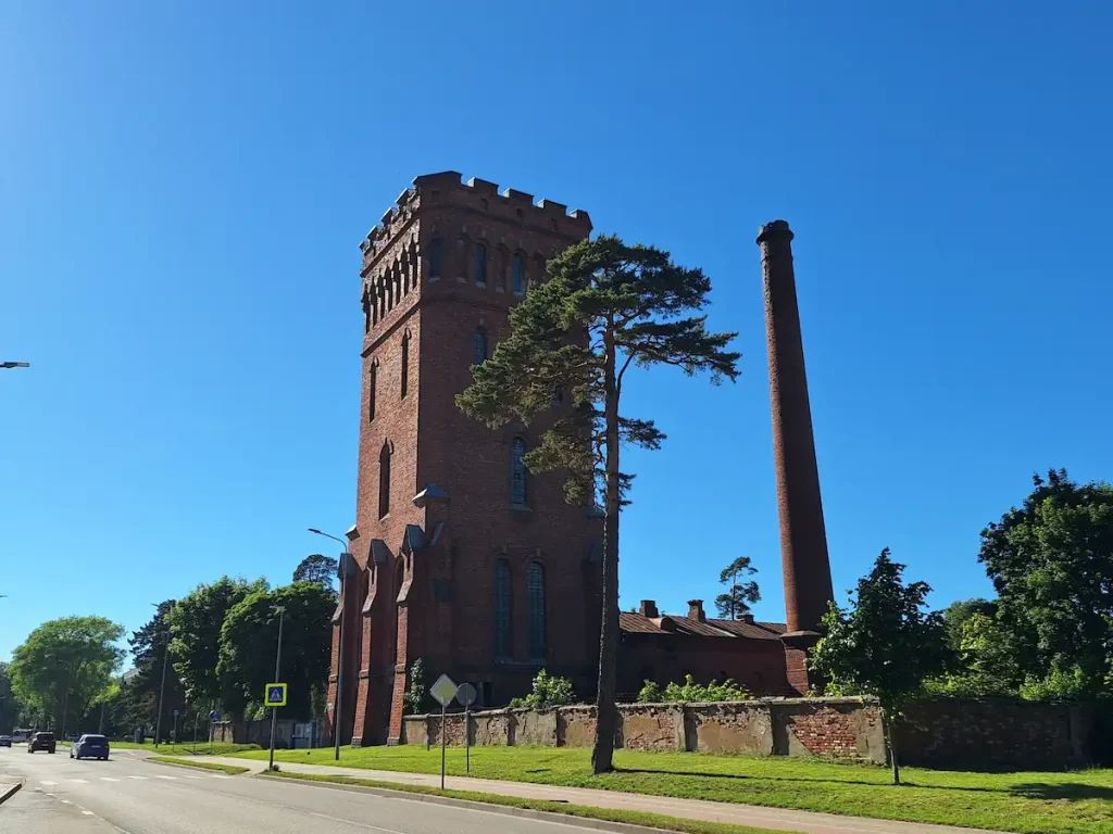 Karosta water tower rising above trees and rooftops in Liepāja