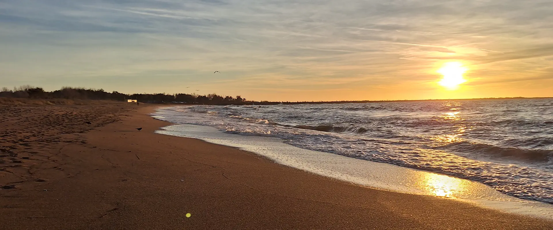 liepaja beach vs palanga beach showing sun setting over the baltic sea