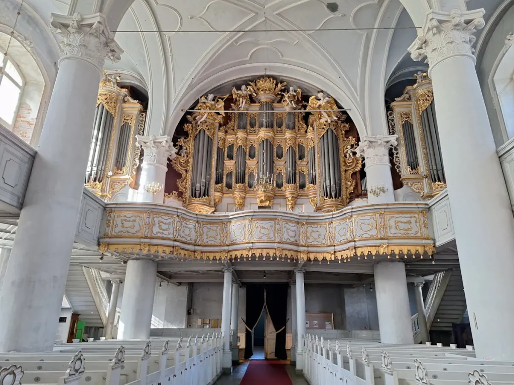 Gilded baroque organ facade inside Holy Trinity Cathedral, Liepāja